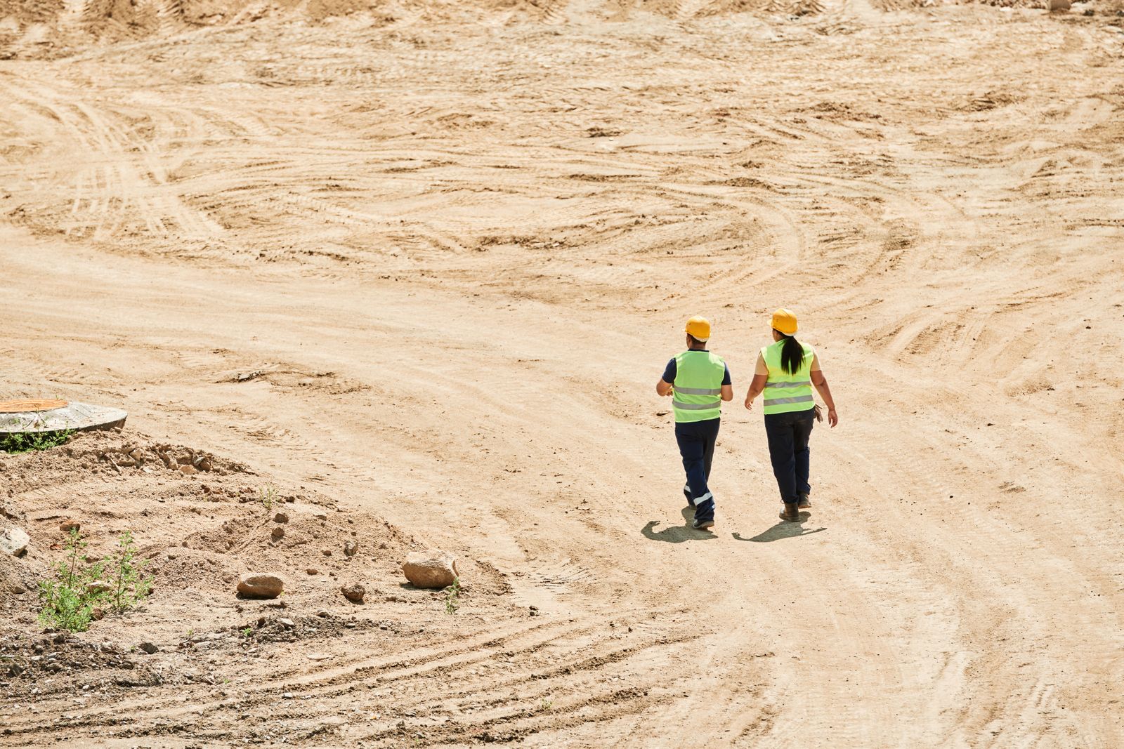 Engineers walking across an active construction site