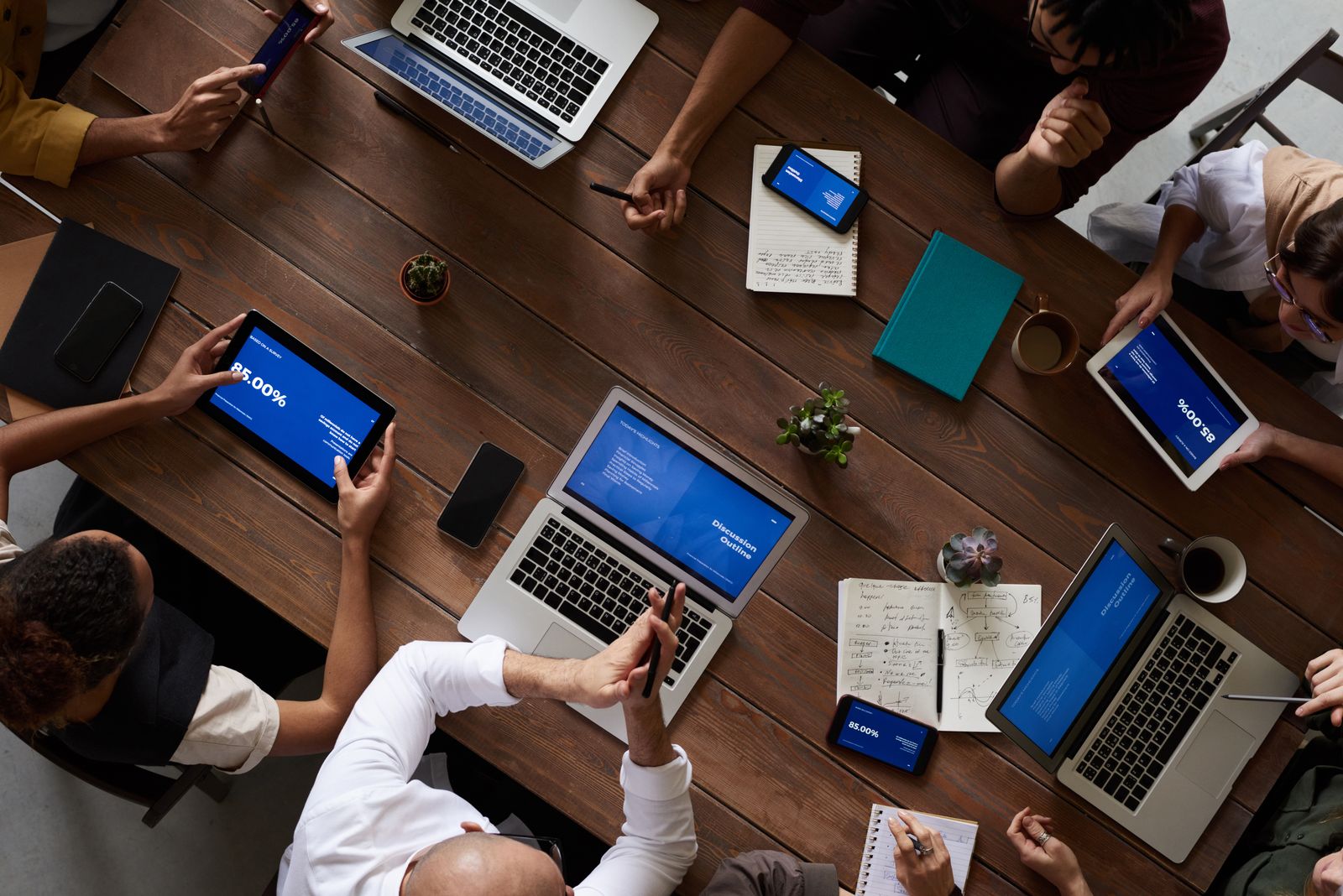 Technology team collaborating around connected devices